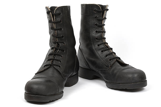 Israeli army boots against white background Israeli army boots, isolated. israeli military boots stock pictures, royalty-free photos & images
