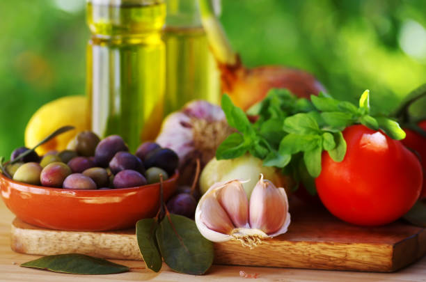 Ingredients for a mediterranean diet on green background close-up Ingredients for a mediterranean diet on green background close-up mediterranean food stock pictures, royalty-free photos & images