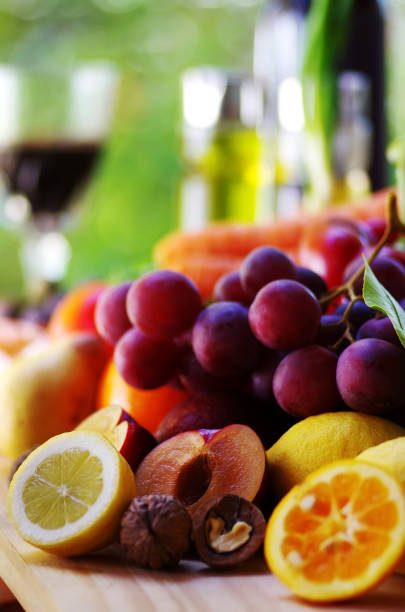 istock bunch of grapes, plums and citic fruits 957076830