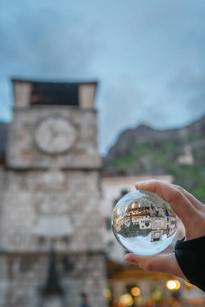 istock Kotor clock tower in a glass ball 957083872