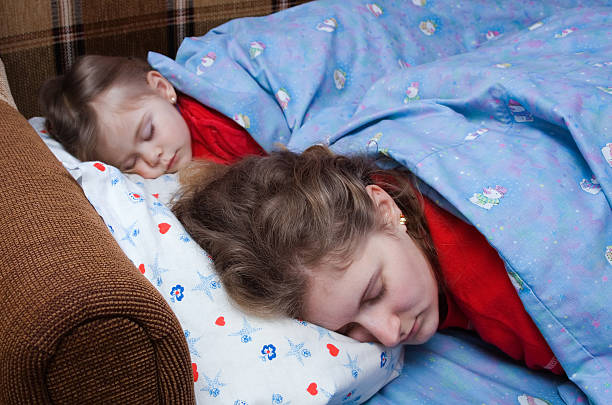 istock Mother and child sleeping together 95708519