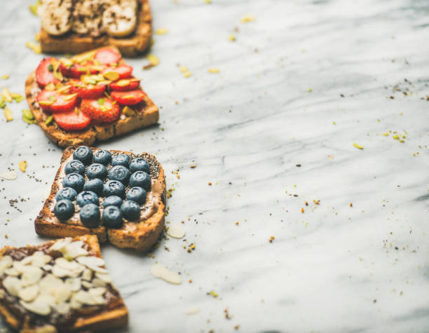 istock Vegan whole grain toasts with fruit, seeds, nuts, selective focus 957090612