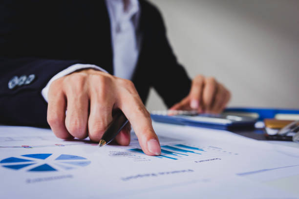 Businessman calculate about cost and doing finance at office. Businessman calculate about cost and doing finance at office, Finance managers task. proof reading documents stock pictures, royalty-free photos & images