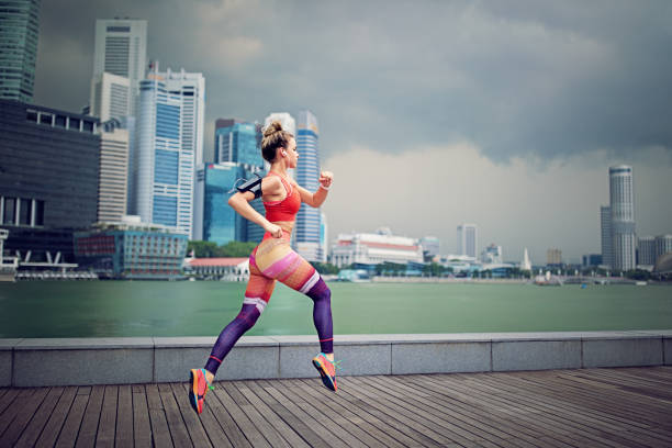 istock Runner girl is sprinting 957094990