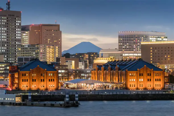 Yokohama red brick warehouse with Top of Mt. Fuji in background. The Yokohama Red Brick Warehouse, a major tourist spot in Yokohama