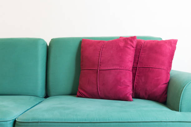istock Green sofa and red backrest pillow in living room 957096482