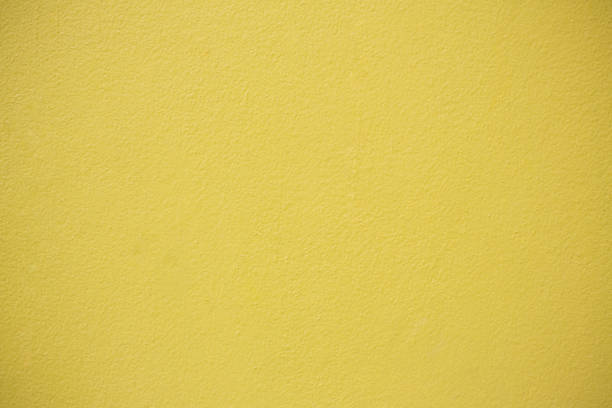 istock Yellow Concrete Wall Background.Concrete wall yellow color for texture background. 957096974