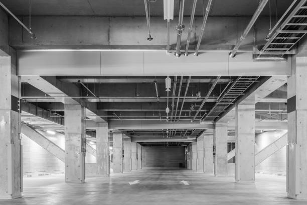 istock Parking garage underground interior, neon lights at night 957097258