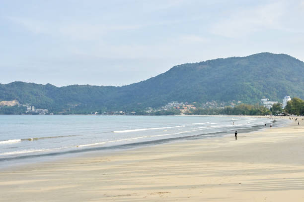 istock Blue sea. Bright sky. Green trees 957099876