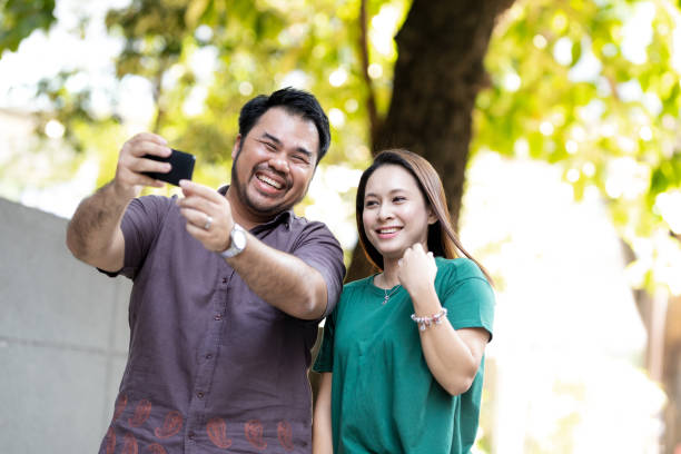 istock Young Malaysian Friends Taking Selfie 957100752