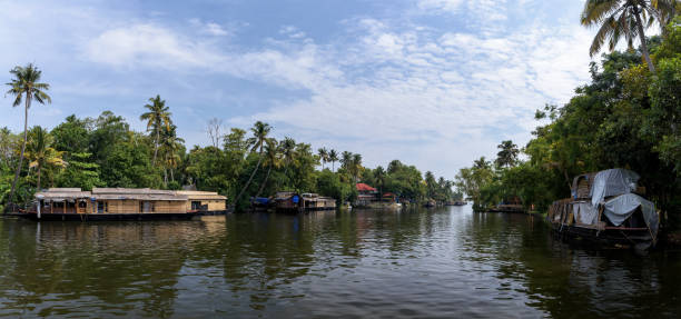 istock Panoramic river view and traditional house boat in Kerala's Backwaters, India. 957101834