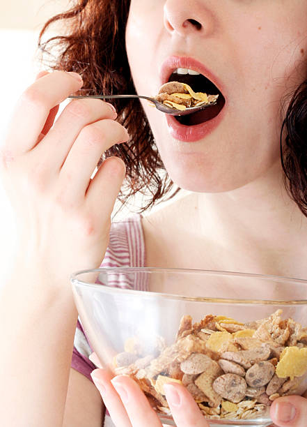 istock Young people eating milk with cereals 95710189