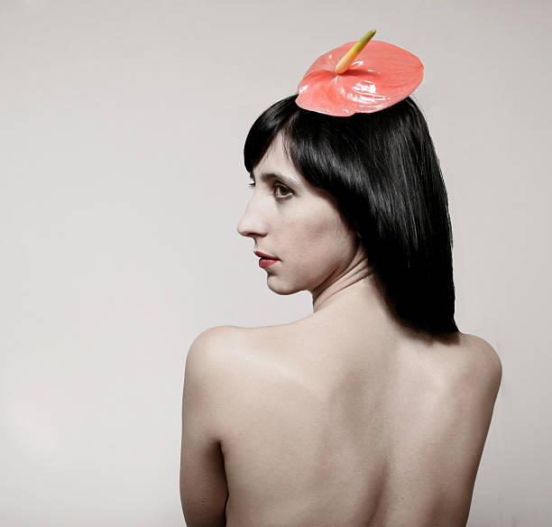istock nude girl with red flower 95710554