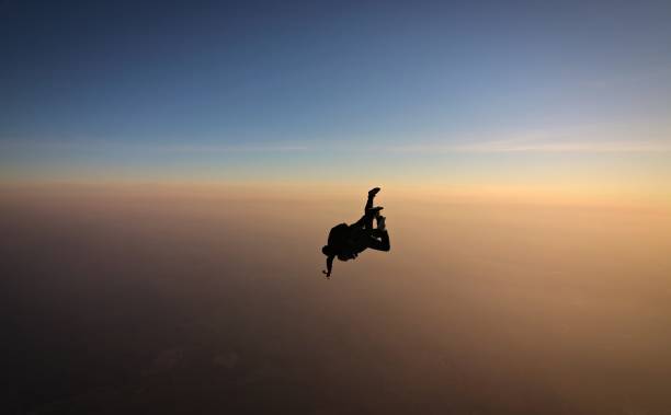 istock Skydiving tandem at the sunset 957112208