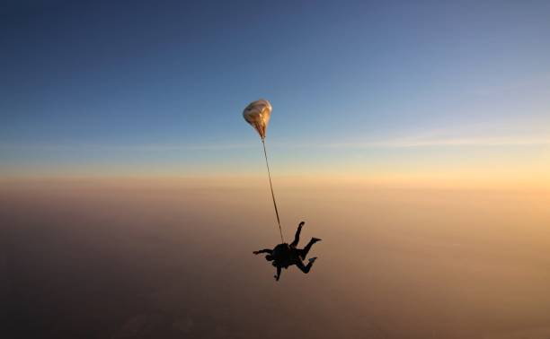 istock Skydiving tandem at the sunset 957112212