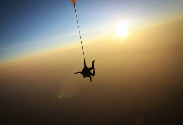 istock Skydiving tandem at the sunset 957112224
