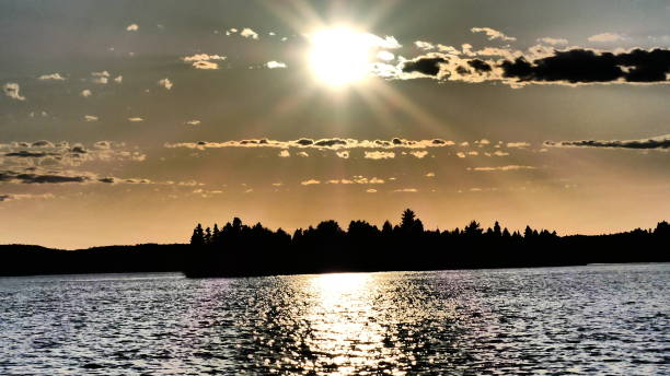 istock Sun and its luminous halo on the water 957115554