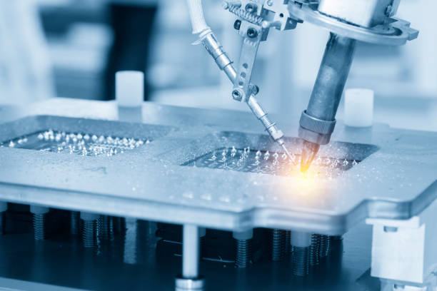 istock The soldering robot welding the circuit board 957119608