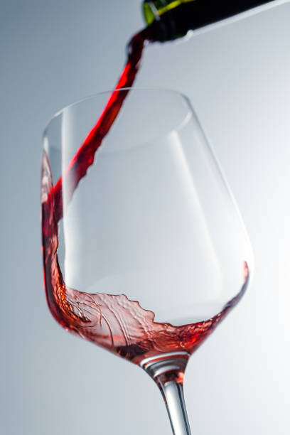 istock Red wine pouring in glass 957119904