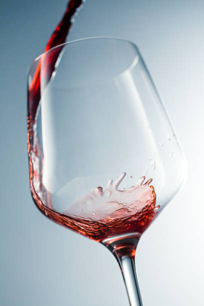 istock Red wine pouring in glass 957120230