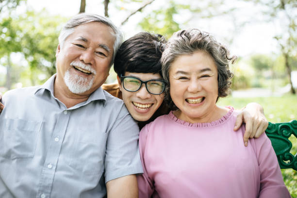 istock Happy family having fun outdoors and smiling 957120634