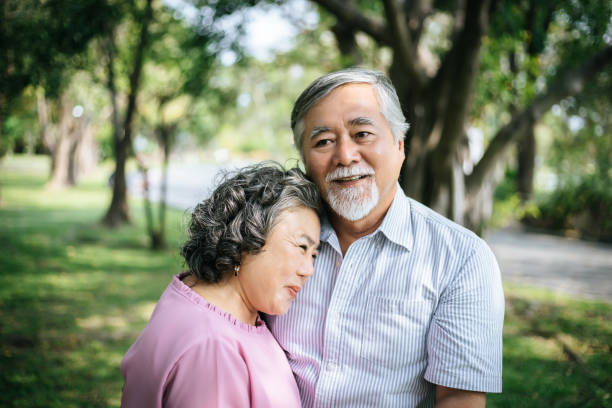 istock Happy senior couple in the park 957124970