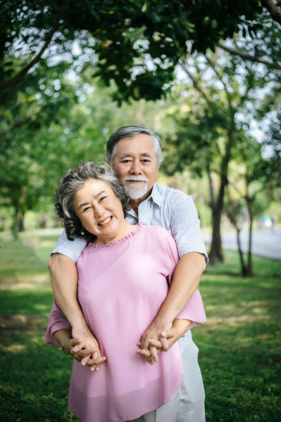 istock Happy senior couple in the park 957126324