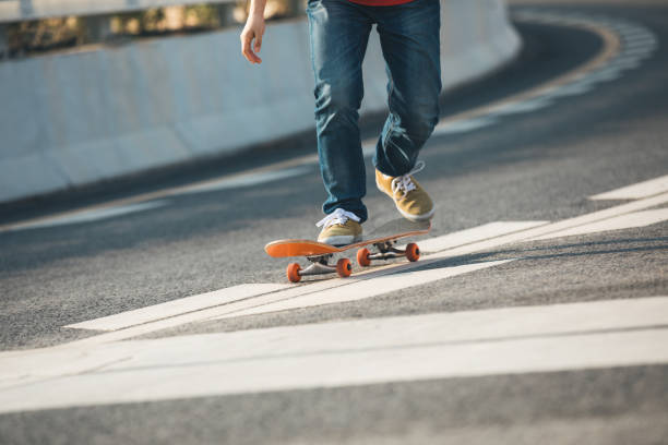 istock Skateboarder sakteboarding on highway 957130888