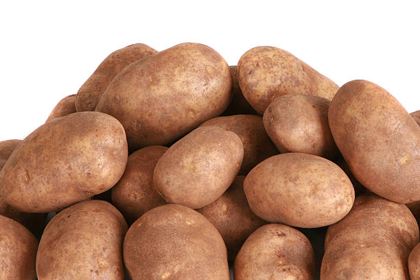 Whole potatoes isolated on a white background stock photo