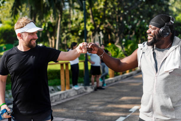 istock People jogging at park 957134360