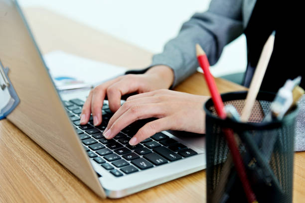 istock Woman hands on laptop keyboard 957134494