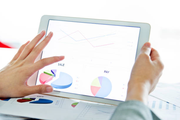 istock Businesswoman holding a digital tablet working 957134640