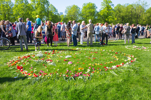 May 9, celebration 73 year after world war 2, peoples, flowers and sun.