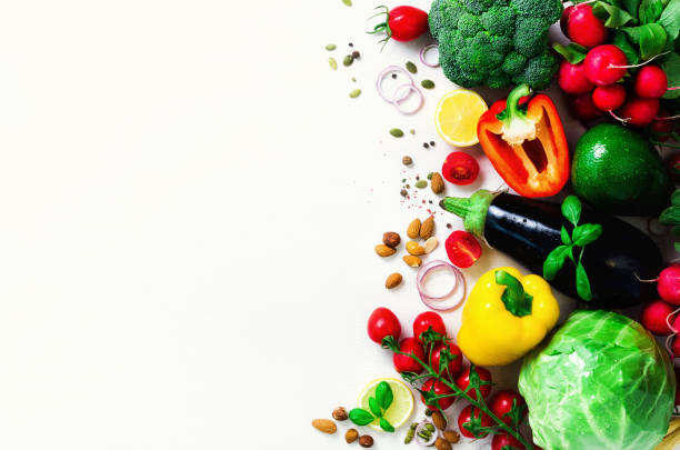 istock Set of fresh vegetables on a white background. Aromatic herbs, onion, avocado, broccoli, pepper bell, eggplant, cabbage, radish, cucumber, almonds, rucola, baby corn. Banner 957139364