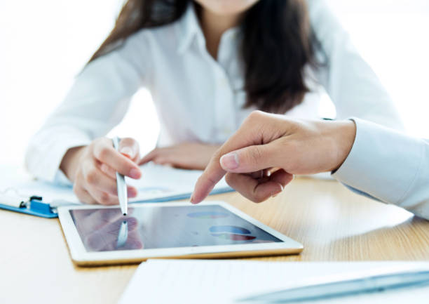istock Businesspeople working with digital tablet 957139466