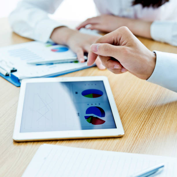 istock Businesspeople working with digital tablet 957139510