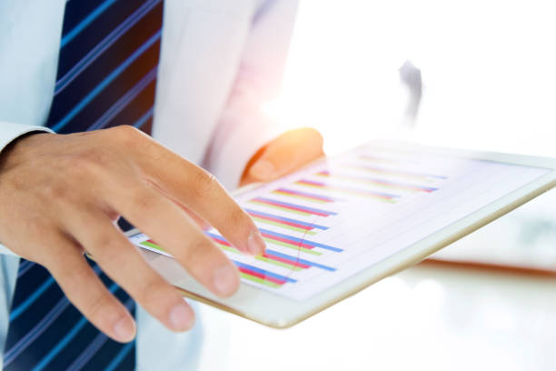 istock A businessman holding a digital working 957140328
