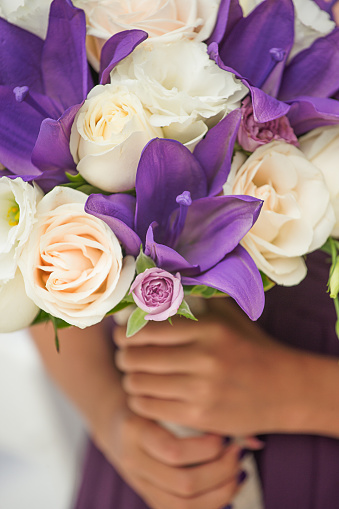 Hand holding bridal flowers
