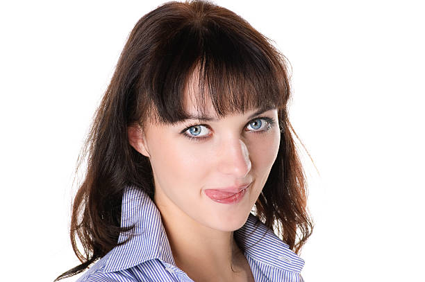 istock young woman sticks out her tongue. 95714412