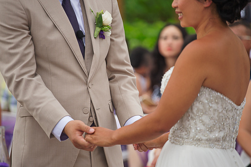 Married couple holding hands