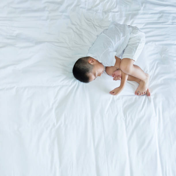 istock Top view of little boy sleeping 957145370