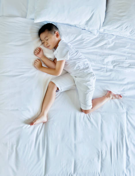 istock Top view of little boy sleeping 957145532