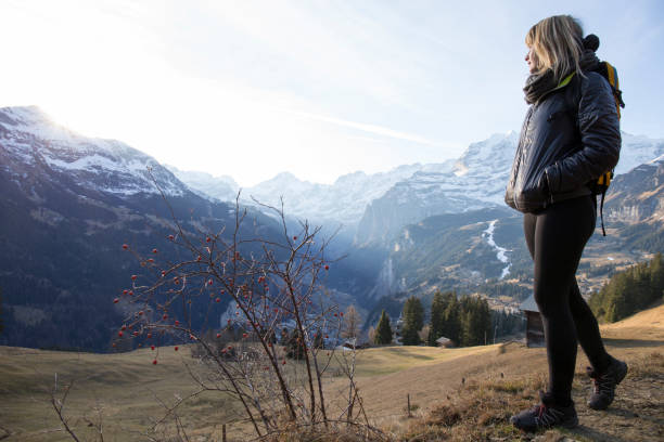 istock Young woman walks in mountain meadow 957155374