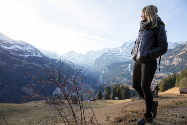 istock Young woman walks in mountain meadow 957155388