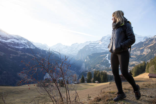 istock Young woman walks in mountain meadow 957155396