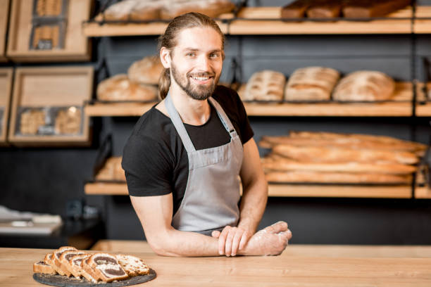 istock Bread sellers working at the bakery shop 957155988