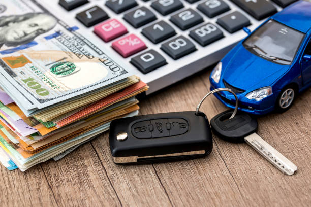 istock Car buying or car rent conception on wooden table 957156064