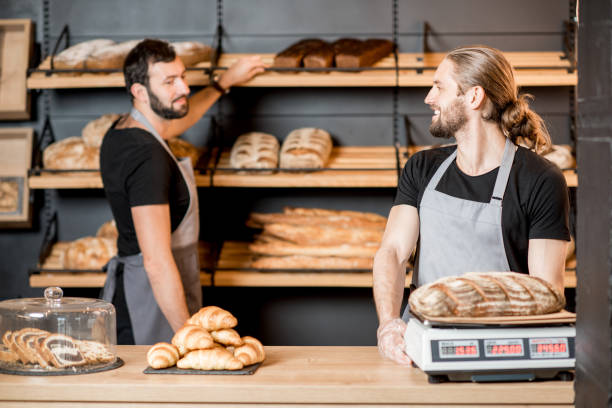 istock Bread sellers working at the bakery shop 957156408