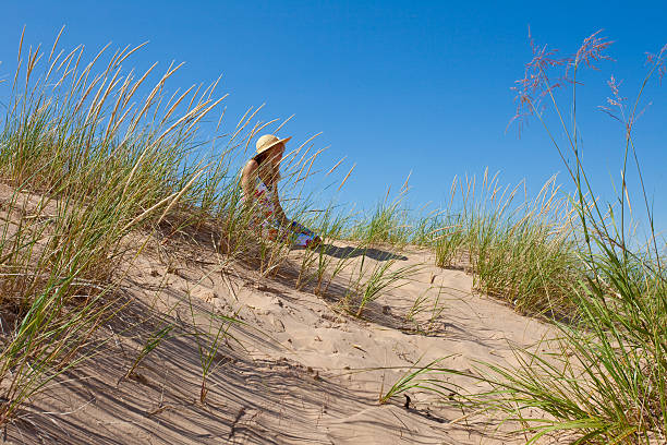 istock Beach girl with sun hat 95716245
