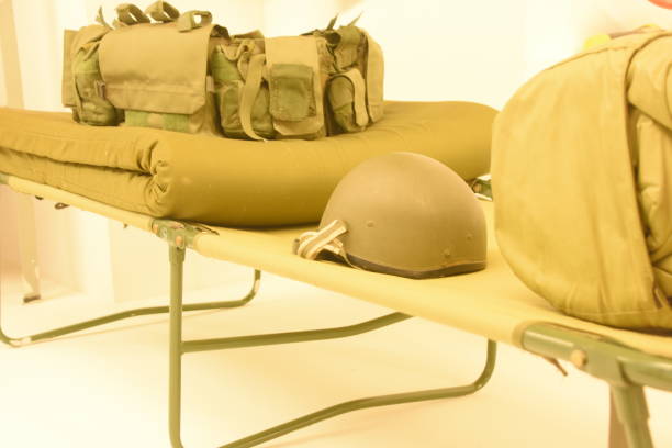 istock Military bed with equipment 957163614